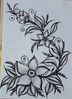 a drawing of flowers and leaves on paper