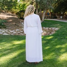 You'll love the newest addition to our All In White collection. Features: True white long sleeve maxi. Elastic at cuff. Lace trim on bodice. Keyhole with button at the back. Elastic waist. Side pockets. Skirt is lined. Fits true to size. Model is 5'10 and is wearing a 1x Size Chart Length Bust Waist S 58" 34" 29" M 58" 36" 31" L 59" 40" 32" XL 60" 42" 36" 1x 60" 46" 44" 2x 60" 50" 44" 3x 60" 54" 48" *All measurements are approximate and done while hanging.* Fabric and Care 100% RayonLining: 95% Modest Flowy White Maxi Dress, White Long Sleeve Modest Maxi Dress, White Long Sleeve Maxi Dress For Daywear, White Lace Maxi, Hanging Fabric, All In, Lace Maxi, Long Sleeve Maxi, White Maxi Dresses