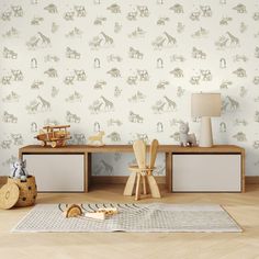 a child's room with toy animals on the floor and wallpaper behind it