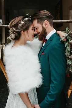 a bride and groom standing next to each other