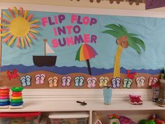 a bulletin board that says flip flop into summer on the wall in a child's playroom