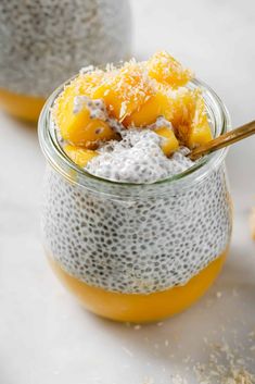 two jars filled with chia pudding and topped with pineapple