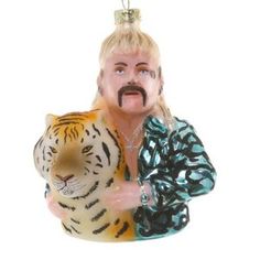 a glass ornament with a man holding a tiger