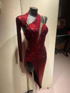 a red dress on display in a room