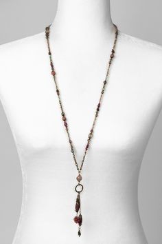 A handcrafted collage strand from the Mauve collection, adjustable in length with it's unique lariat design. Antique Brass (lead and nickel free) Peach Moonstone, Lepidolite, Czech Glass 32.5", adjustable We hand select our natural materials, thus there may be slight variations in color and/or size that will not detract from the overall aesthetic Our unique handcrafted designer jewelry for women is made in America, with each design created individually in our personal design studio in Floyd VA U Adjustable Lariat Jewelry With Gemstone Beads, Adjustable Lariat Necklace With Natural Stones, Adjustable Gemstone Beads Lariat Necklace, Bohemian Adjustable Lariat Necklace With Gemstone Beads, Adjustable Bohemian Lariat Necklace With Gemstone Beads, Adjustable Lariat Jewelry With Natural Stones, Adjustable Long Gemstone Beads Necklace, Adjustable Lariat Necklace With Gemstone Beads, Adjustable Lariat Beaded Necklace With Natural Stones