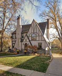 an old house with a large front yard