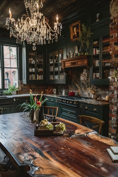 a wooden table sitting in the middle of a kitchen next to a brick wall and window