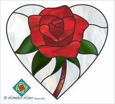 a stained glass heart with a red rose