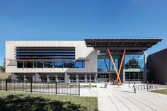 the exterior of a building with people walking around