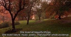 there is a woman walking through the park with trees in the foreground and a quote on it