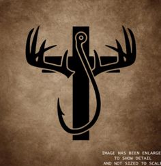 the silhouette of a deer's head on top of a cross with words above it