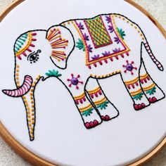 an embroidered elephant is shown in the hoop