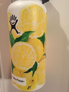 a hand sanitizer with lemons painted on it