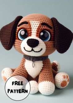 a crocheted stuffed dog sitting on top of a white table next to a sign that says free pattern