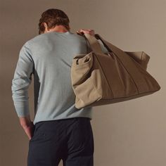 Our modern and sleek duffle bag is made from Italian calf suede with contrast hand glazed edges and is functionally designed, becoming the essential every day or travel ready bag. Additional Information:• Italian Calf Suede • Fully lined with internal zippered pocket• Side Welt Pockets• Length: 21.8", Width: 8.6" Height: 15.75"• Top Handle Drop: 9"• Removable Grosgrain adjustable shoulder strap Denim Polo, Open Sky, Jumpsuit Jacket, Weekend Bag, Backpack Tote Bag, Sweater Pants, Outerwear Sweater, Denim Pant, Weekender Bag