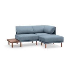 The Range Fabric 3-Piece One Arm Sectional Lounger with Sofa Table is a compact yet versatile addition to our Range Collection. It offers a cozy corner, a handy table for books, and an attached ottoman for streaming comfort. With a low profile, sophisticated lines and a modular design, this piece opens up endless possibilities for arrangements and additions. A harmonious blend of style and comfort, this sectional lounger sofa invites you to explore the new dimensions of relaxation. | Burrow Modu Sofa Lounger, Lounger Sofa, Pile Of Books, Living Room Furniture Sofas, Cozy Corner, Modular Design, Sofa Table, Modular Sofa, Endless Possibilities