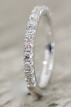 a white gold wedding band with round cut diamonds