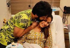 a man hugging a woman in a hospital bed