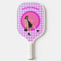 a pink and white racket with a woman's image on the back of it