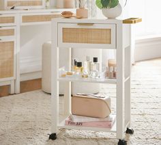 a white table with cosmetics on it in a room