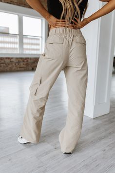 Unleash your adventurous side with our Kristie Cargo Parachute Pants! Made from durable, lightweight fabric, these pants are designed to keep up with your active lifestyle. With multiple pockets and a comfortable fit, they combine style and functionality for your ultimate comfort and convenience. Elevate your wardrobe and conquer any terrain with Kristie Cargo Parachute Pants! Model Info: Models are 5'7", Size 2, wearing smalls Material: 100% nylon Cargo Jeans With Pockets For Outdoor Activities, Wide Leg Parachute Pants With Pockets For Outdoor Activities, Outdoor Cargo Jeans With Multiple Pockets, Wide Leg Cargo Jeans For Outdoor Activities, Relaxed Fit Straight Leg Cargo Pants For Hiking, Wide Leg Cargo Jeans With Multiple Pockets For Outdoor, Outdoor Pants With Side Pockets, Wide Leg Parachute Pants With Cargo Pockets For Outdoor, Wide Leg Cargo Jeans With Side Pockets For Outdoor