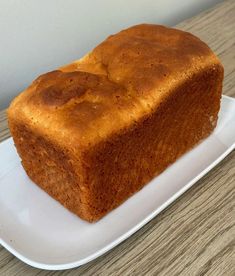 a loaf of bread sitting on top of a white plate