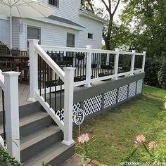 the steps and railings on this deck are painted white