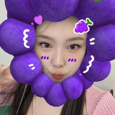 a girl with purple hair and flowers on her head