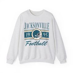 WELCOME TO MY SHOP! This Jacksonville Football Crewneck, Vintage Jacksonville Football Sweatshirt, Jaguars Sweatshirt, Jacksonville Sweater, Jacksonville Gifts, Game Day Shirt, Jacksonville Jaguars, Jaguars Sweater, Jaguars T-Shirt, College Gifts, Football Lovers, Gift for her, Gift for him, American Football, Super Bowl Shirt, Christmas Gifts, Birthday Gifts, Sunday Football, Jaguars Football Retro Crewneck Hoodie, Retro 90s Jacksonville Unisex Sweater, Vintage Football Sweatshirt, Jaguars Fan, Throwback Long Sleeve T-shirt For Sports Events, Throwback Sports Season Tops With Ribbed Cuffs, Throwback Long Sleeve Tops For Game Day, Winter Fleece Tops For Sports Fans, Winter Fleece Tops For Fan Gear, Winter Fleece Top For Fan Gear, Team Spirit Fleece Tops With Graphic Print, Collegiate Crew Neck Hoodie For Sports Season, Collegiate Crew Neck Hoodie