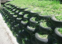 a bunch of tires that are sitting in the grass