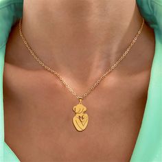 The "Embracing Mother and Child" Pendant Necklace is a touching portrayal of the close, protective love a mother holds for her child. This stainless steel piece features the silhouette of a mother holding her child in a loving embrace, its sleek design evoking warmth and affection that resonates deeply with any wearer. Perfect for Mother's Day, as a gift for new mothers, or as a token of appreciation, this necklace is a daily reminder of love and familial bonds. Its stainless steel composition ensures a lasting shine and resilience, suitable for everyday wear. We stand behind our jewelry, offering a lifetime guarantee to ensure you feel confident and secure in your purchase. High-Quality Craftsmanship: Our commitment to quality is evident in the careful crafting of this necklace. Employing Loving Embrace, Gifts For New Mothers, The Close, New Mothers, Kids Jewelry, Mother And Child, A Mother, Daily Reminder, Feel Confident