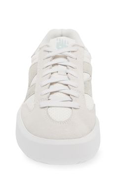 From the court to the street, this '80s-throwback tennis shoe scores new love as a sneaker made of leather and mesh with chunky proportions updating the look. The plush interior and supportive insole ground every step in game-winning comfort. Lace-up style Removable, cushioned insole with arch support Leather and textile upper/synthetic lining/rubber sole Imported New Balance High-top Sneakers With Translucent Outsole, New Balance Sporty High-top Sneakers With Translucent Outsole, New Balance High-top Sneakers With Rubber Waffle Outsoles, New Balance Mesh High-top Sneakers, New Balance High-top Mesh Sneakers, Retro Low-top Tennis Sneakers, New Balance High-top Skate Shoes With Perforated Toe Box, New Balance Sporty Sneakers With Vulcanized Sole, New Balance High-top Lace-up Sneakers With Gum Sole