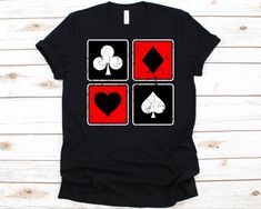 four card suits with hearts and spades on black t - shirt sitting on white wooden background