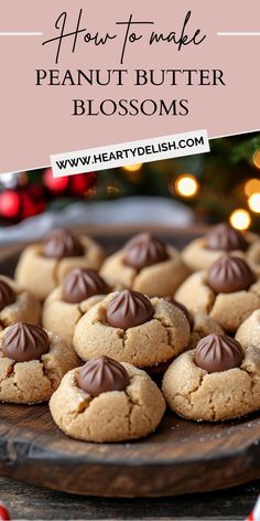 peanut butter blossoms on a wooden plate with candy canes and christmas lights in the background