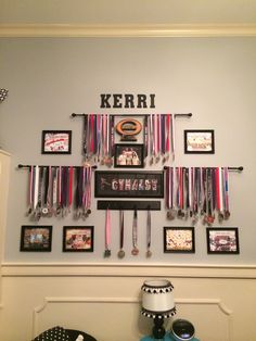 the wall is decorated with medals and ribbons