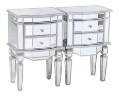 two mirrored side tables with drawers and one drawer on each side, both in white