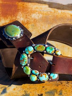 My love for old leather began when I moved out West. I search the world over, through barns saddle shops and ranches, for old retired saddle leather. This leather is the backdrop for my "Wild West" vintage leather belts! Shown here with perfect Kingman Turquoise oval concho, on 3 inch wide vintage leather. These look amazing with any of our Mas Grande Turquoise buckles. These belts sport two conchos measuring around three inches each! Buckles are sold separately. Some of this leather is over 100 Artisan Leather Belt Buckle With Antique Design, Rustic Leather Belt For Rodeo, Rustic Leather Belt Buckles For Ranch, Rustic Leather Belt Buckles For Rodeo, Vintage Leather Belts For Ranch, Rustic Hand Tooled Belt For Western-themed Events, Vintage Turquoise Belt With Concho, Southwestern Leather Belt Buckles For Rodeo, Rustic Antique Buckle Belt For Rodeo