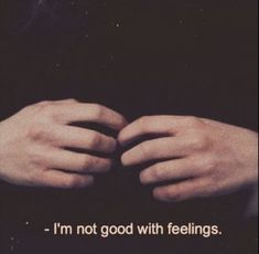 two hands holding each other with the words i'm not good with feelings