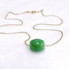 "Simply elegant necklace is make with a stunning color jade bead . Green jade bead floating gorgeously on a delicate 14k gold filled cable chain. Smooth round jade bead is about 11-12mm in size. 14k gold filled spring ring clasp. Necklace is 18\" in length unless otherwise requested. PLEASE NOTE: As you can see in the photos there are natural occurring blemishes and variation that give these pearls character. These are stock photos so please note pearls are vary in shape and color due to availab Gold Jade Necklaces With Polished Beads, Gift Emerald Necklace Single Strand Jade, Jade Bead Necklace, Color Jade, Floating Necklace, Clasp Necklace, Elegant Necklace, Jade Beads, Elegant Necklaces