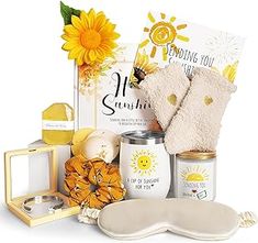 sunflowers, mitts, and other items are arranged on a white surface