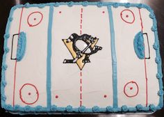 a birthday cake for a hockey player with a penguin on the goalie's chest