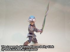 the legend of zelda fierce delity link figurine is shown in action