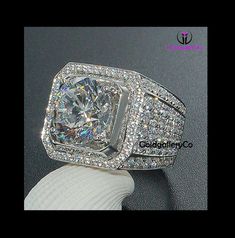 ITEM SPECIFICATION. Main stone: CZ/Moissanite Diamond Main Stone weight: Approx 4.5 ct Metal type: 925 sterling silver Finish: White Gold Rhodium What is Signity Simulated Diamonds? Hello Everyone, As you must be wondering what is Signity Diamond and why you should buy them instead on Real Diamonds ? Here is a quick comparison and few facts about Signity Diamonds. Signity Diamond's are bright white man made diamonds with more sparkle than natural diamonds. They are bright and sparkly and display Crystal Engagement Rings, Engagement Party Gifts, Ring Settings Types, Diamond Fashion Rings, Trendy Ring, Finger Rings, Fashion Accessories Jewelry, Crystal Rings, Sapphire Diamond