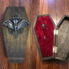 two wooden boxes with metal decorations on them