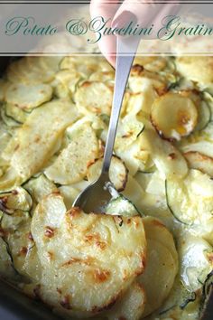 a close up of food on a pan with a spoon in it and the words potato & zucchini gratin