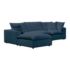 a blue sectional couch with pillows on it's back and the seat folded down