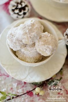 two white bowls filled with snowballs on top of a table