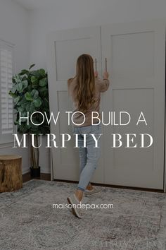 a woman standing in front of a door with the words how to build a murphyy bed