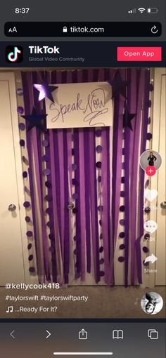 an image of a door decorated with purple streamers and stars for a speak now event