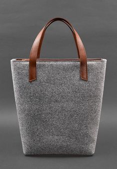 Elevate your everyday style with our Exclusive Women's Felt Shopper Bag, designed with luxurious leather inserts. Crafted from premium felt, this spacious and durable bag offers both functionality and sophistication. The rich leather accents add a touch of elegance, making it the perfect accessory for shopping, work, or weekend outings. With its unique blend of materials and timeless design, this exclusive shopper bag is a must-have for those who appreciate quality and style. Dimensions: 14.6 x 16.5 x 4.7 inches. Leather Accents, Natural Tan, Leather Pieces, Shopper Bag, Burgundy Color, Backpack Purse, Coils, Scandinavian Style, Everyday Style